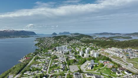 Forward-moving-aerial-towards-Gaaseid,-Hatlane-and-Ratvika-before-Alesund-Norway---Summer-aerial