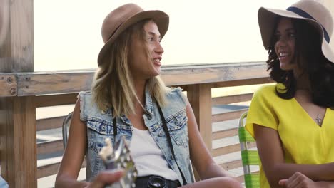 young adult friends hanging out on a rooftop