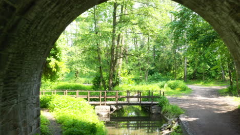 Flying-under-an-old-stone-train-arch-bridge