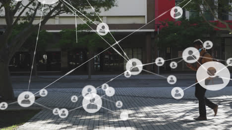 animation of network of connected people icons with businessman walking in street