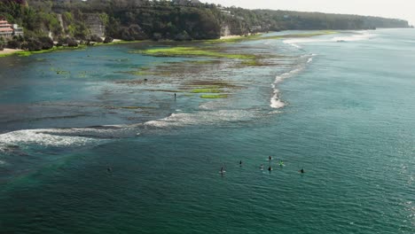 the surf spot of bingin at the cliffs of uluwatu during a sunny day