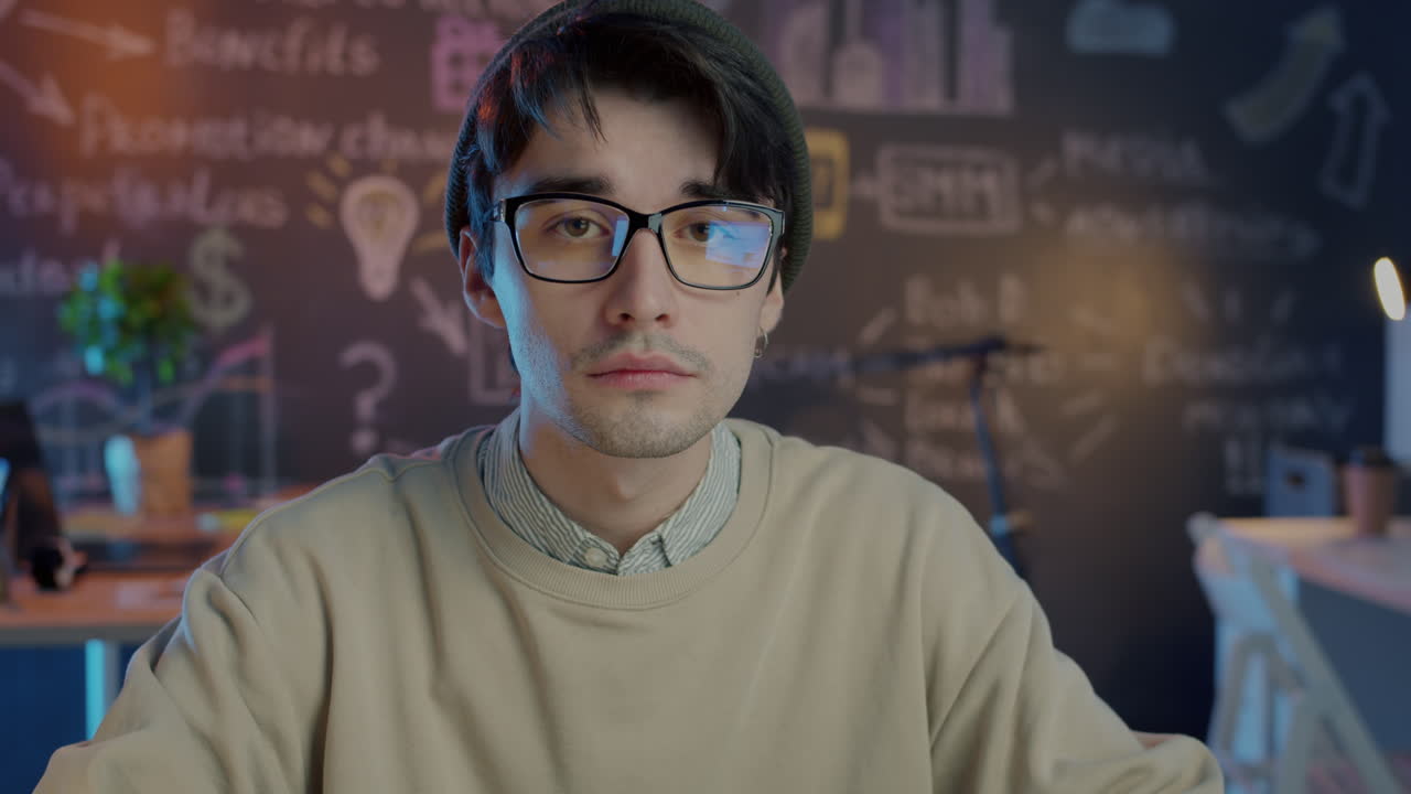 Man looking at camera in modern office