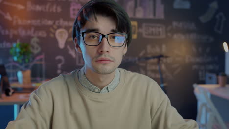 man looking at camera in modern office