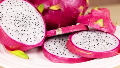 sliced and whole dragon fruit on display