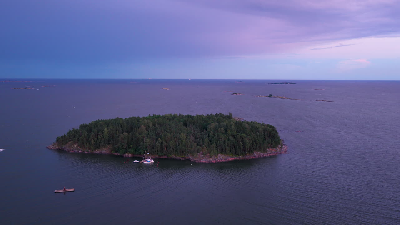 Aerial view of the Kaarmesaari island, moody dusk sky in the finnish archipelago
