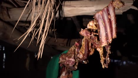 dry meat hanging from a tent in the nomad base in the desert in morocco