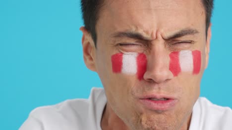 Man with peruvian national flag upset with a referee