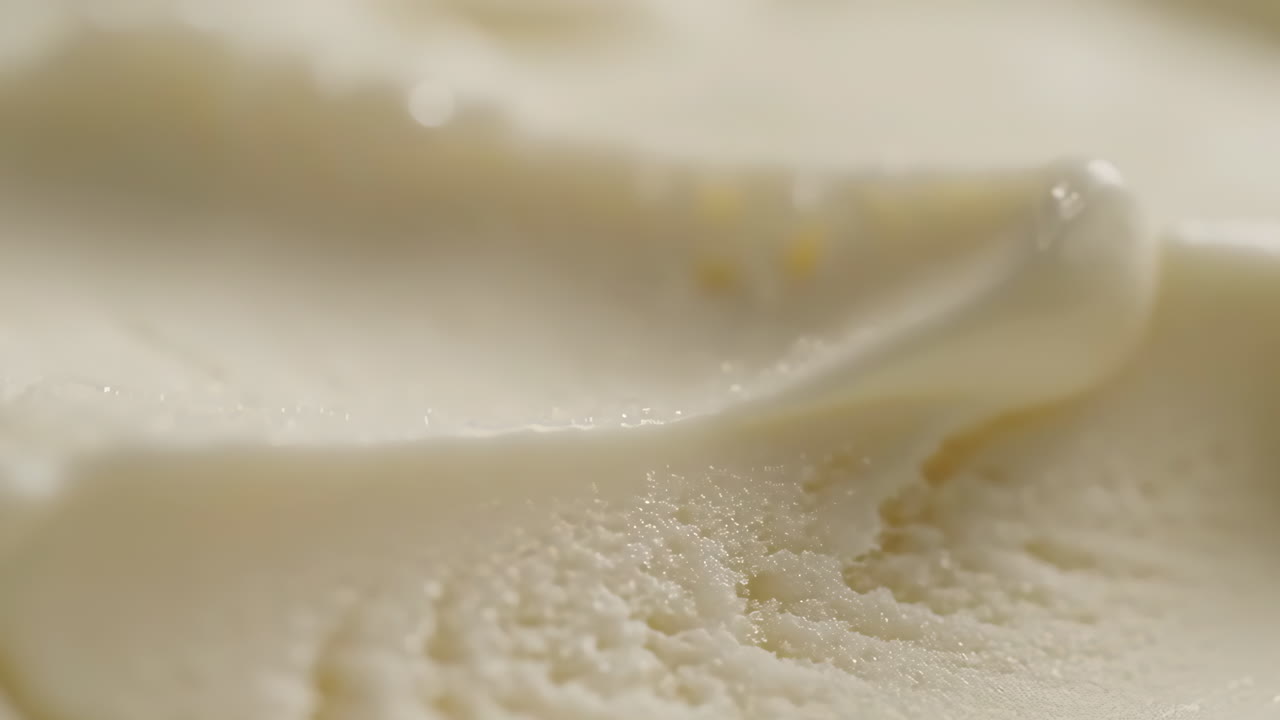 Close-up of smooth, creamy vanilla ice cream texture
