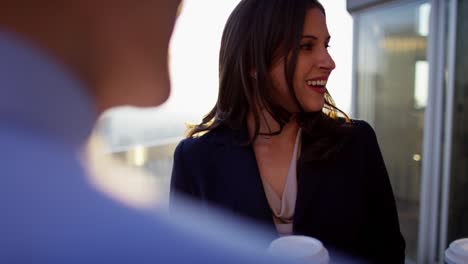 multi ethnic business colleagues coffee break on rooftop