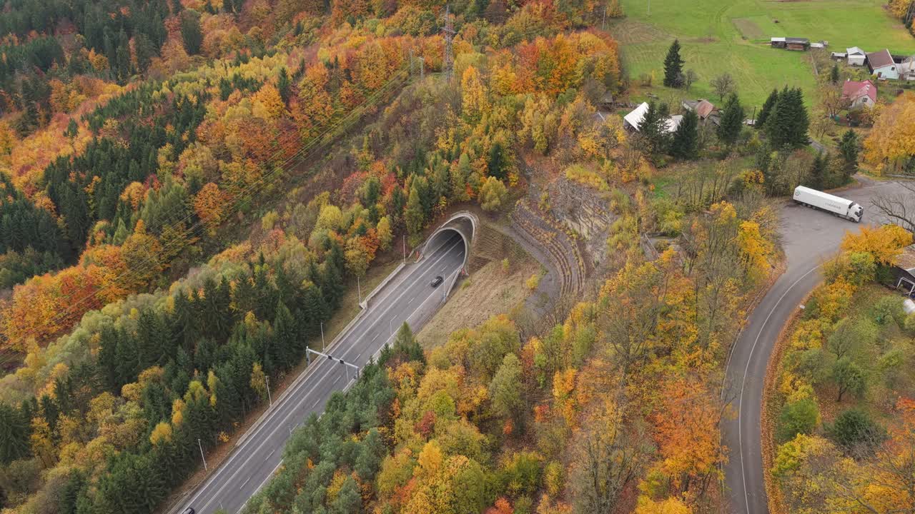 The Hřebeč Tunnel near Moravská Třebová from an aerial view. Cars passing through in both directions
