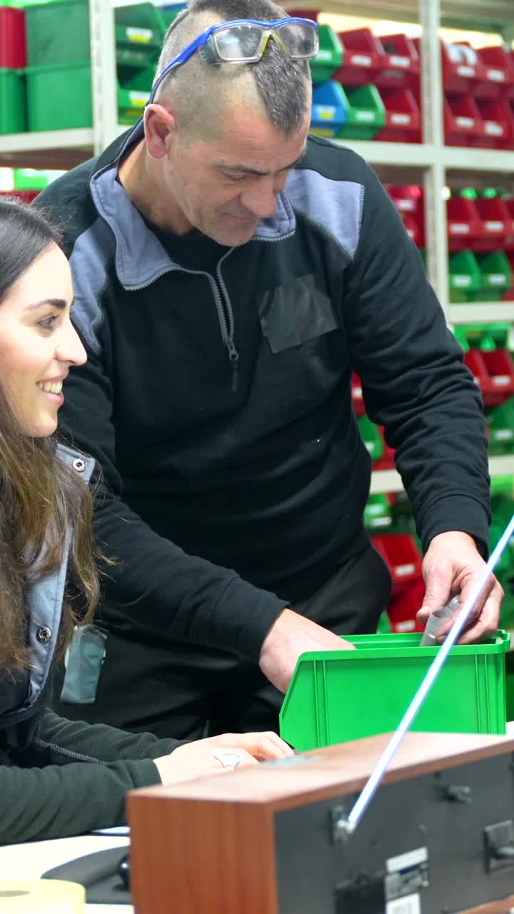 Two people working together indoors