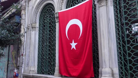 turkish flag hanging on a building in istanbul