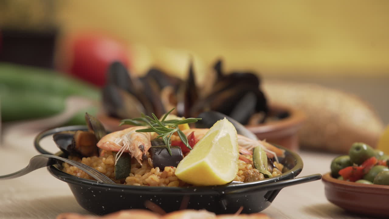 Paella traditional Spanish food, served on tapa plate