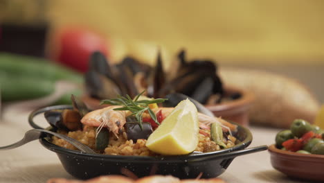 paella traditional spanish food, served on tapa plate