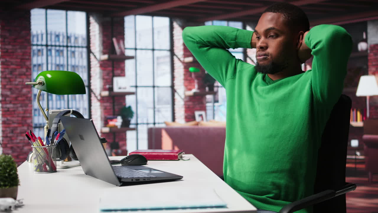 Vertical Video Teleworker fixing his back posture and suffering a muscle cramp at home desk