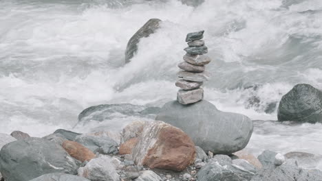 balanced stones by a river