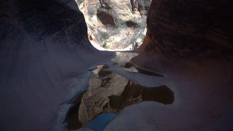 Natural-Eroded-Tunnel-and-Puddle-in-Sandstone-Formations,-Beauty-of-Nature