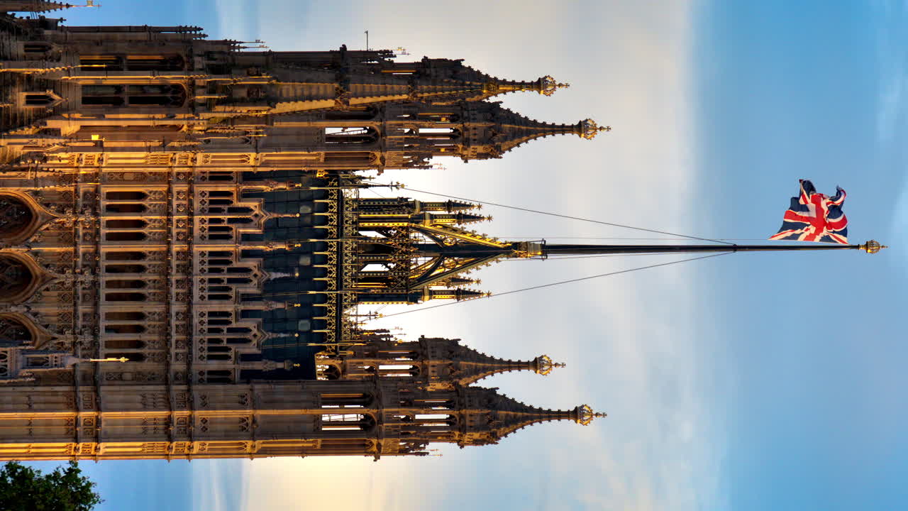 Vertical view of the Victoria Tower of the Westminster Palace in London downtown, United Kingdom. Slow motion
