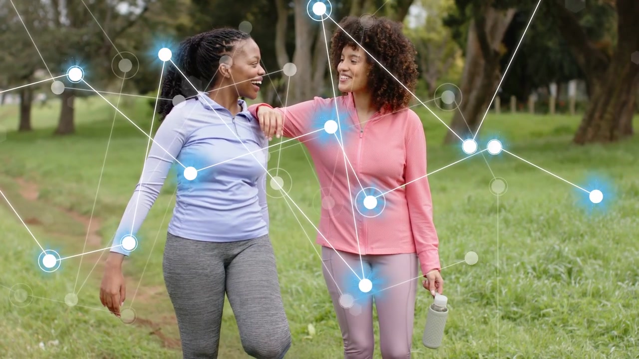 Friends walking, right woman gesturing wrist, sharing fitness data, animated nodes intensifying