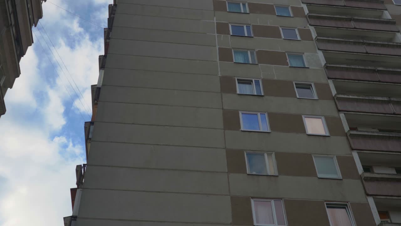 Grey Eastern European residential flat buildings dolly to right