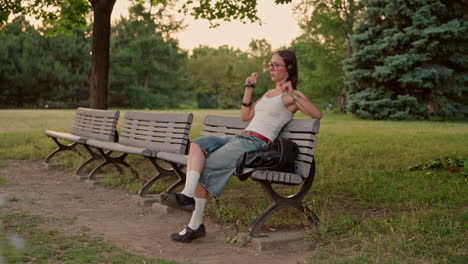 young woman sits down alone to unwind from phone and digital media and begin journaling