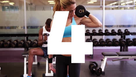 large number 5 animation over people lifting weights in gym