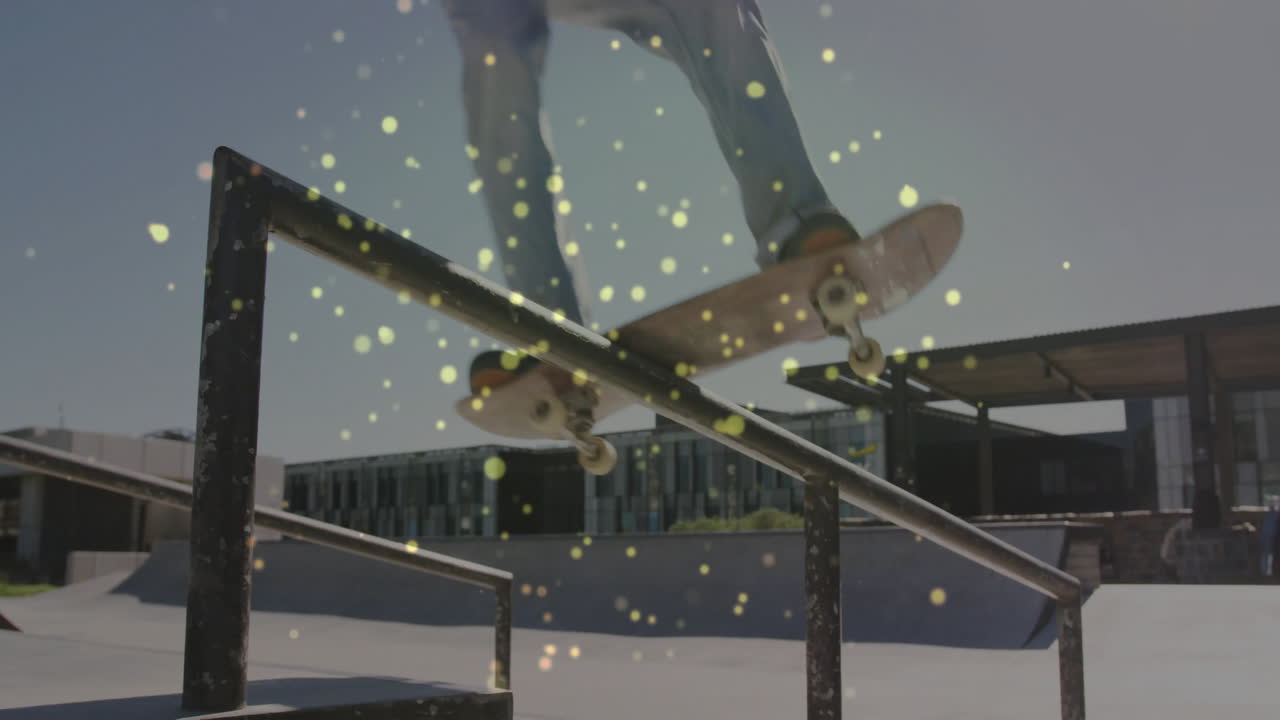 Skateboarder grinding handrail at skatepark, showcasing tech light particle animations
