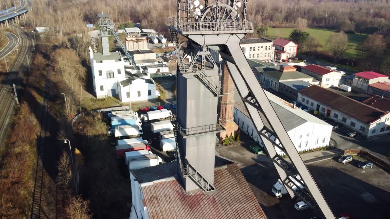 Winding Tower- Hoist Tower Structure Of An Old And Non-functional Coal Mine In Ostrava, Czech Republic. - aerial ascend shot