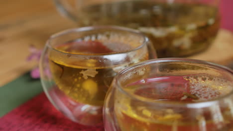 jasmine tea in glass teapot and cups