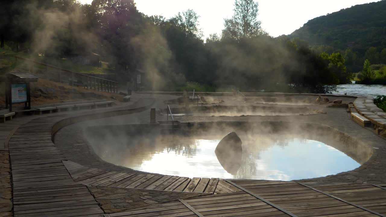 Establishing shot of Muiño da Veiga thermal baths in Ourense, Galicia, Spain