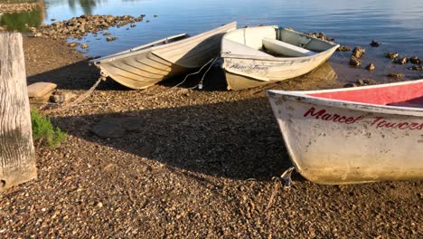 time-lapse of boats on a tranquil lake shore.