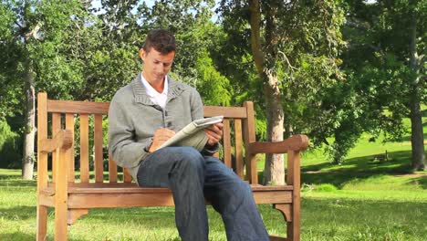young man doing crosswords