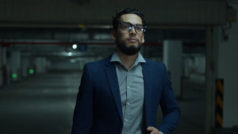 stressed businessman in a parking garage