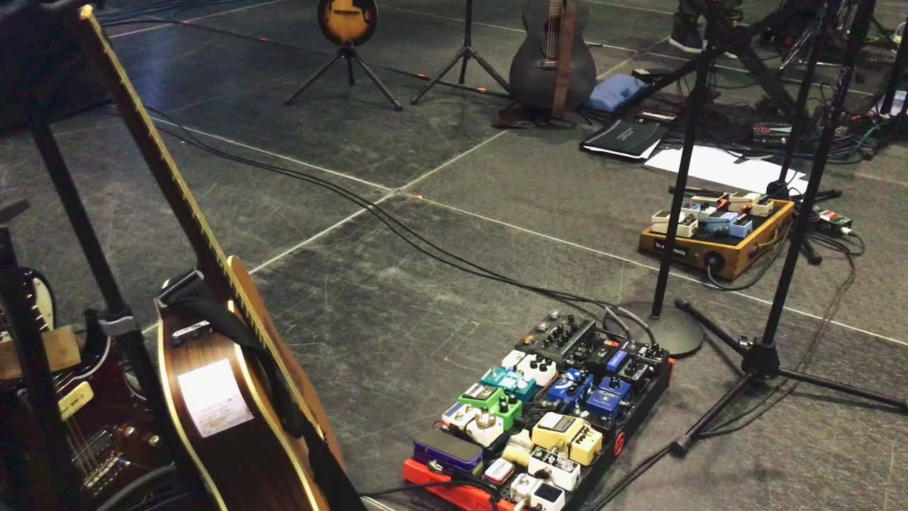 Electric acoustic guitars and pedals on stage