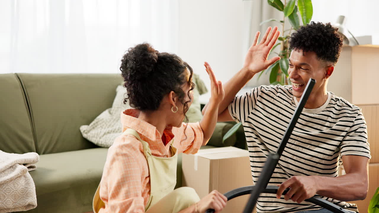 Couple assembling furniture after moving