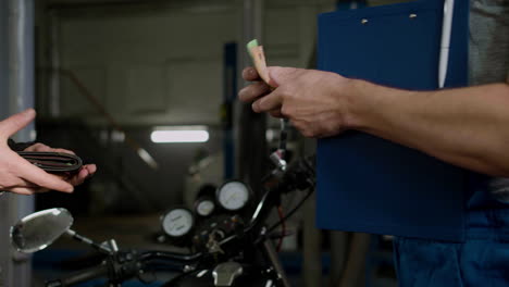 Two-men-talking-at-the-garage