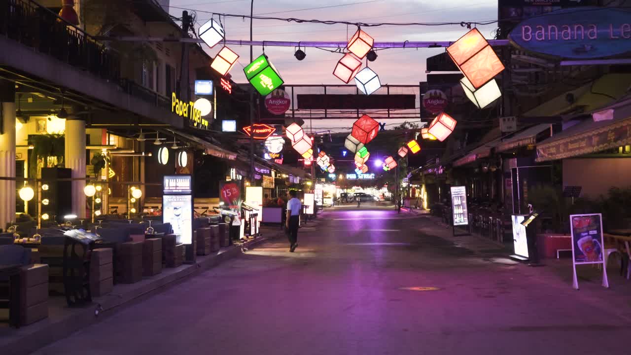 Business owner looking for customers, empty Pub Street during covid-19 2020.  Businesses almost empty in this tourist hot spot, home to Angkor Wat, Siem Reap, Cambodia.