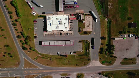 Semi-trucks-and-trailers-exiting-truck-stop-from-Jasper-Florida