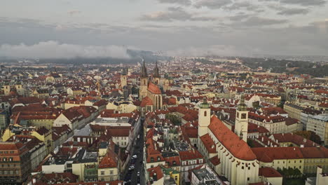 prague czechia aerial v132 drone flyover capturing historic old town square's gothic architectural astronomical clock tower and church of our lady before týn - shot with mavic 3 cine - november 2022