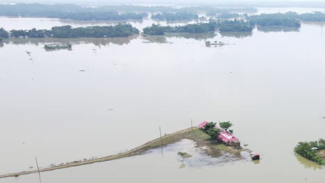 a school at a hoar area submerged by flood water. severe flooding in bangladesh. aerial view