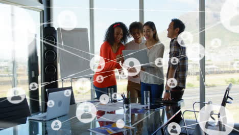 animation of network of connections with icons over diverse colleagues discussing work
