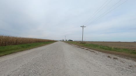 pov through driver's window while driving through rural iowa