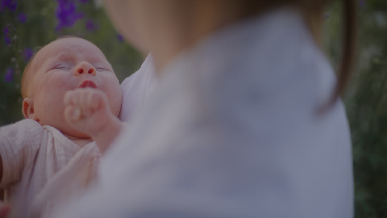 Crying Baby Close-up in Mother's Arms