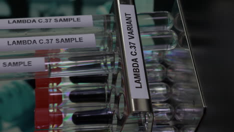 lambda c37 variant test tube samples being inserted into rack