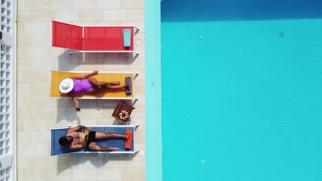 couple relaxing by the swimming pool