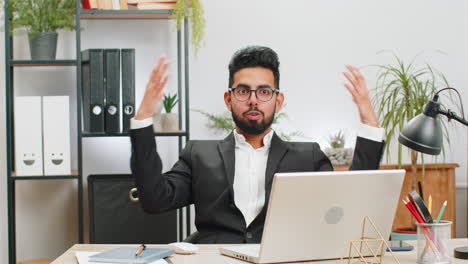 Excited-amazed-Indian-businessman-looking-shocked-surprised-wow-showing-head-explosion-gesture