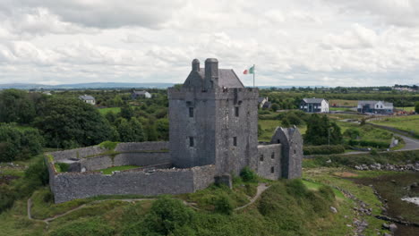 aerial shot rotating around dunguaire castle in county galway, ireland