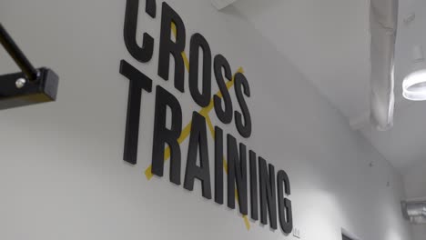 modern cross training gym sign on wall