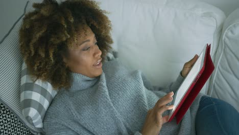 woman chilling with tablet at home