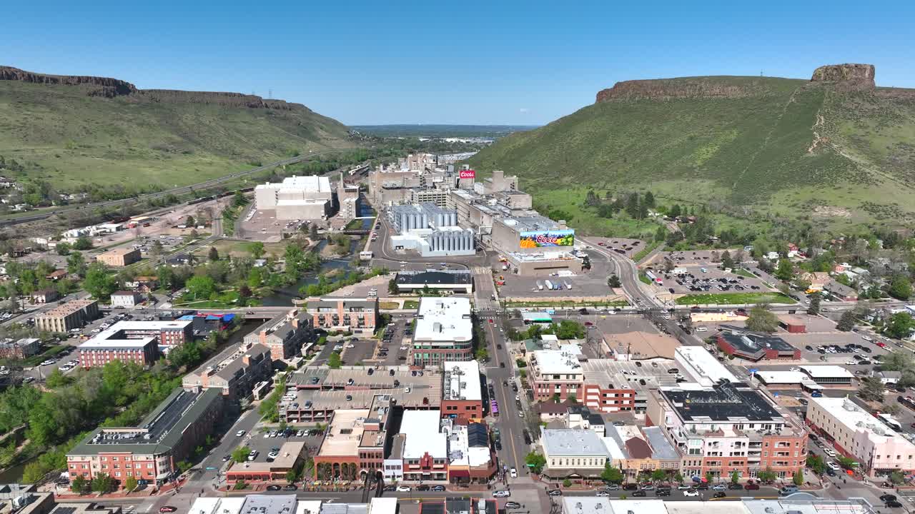 Aerial Drone Flyover of Golden Colorado downtown approaching Coors Brewery on a summer day